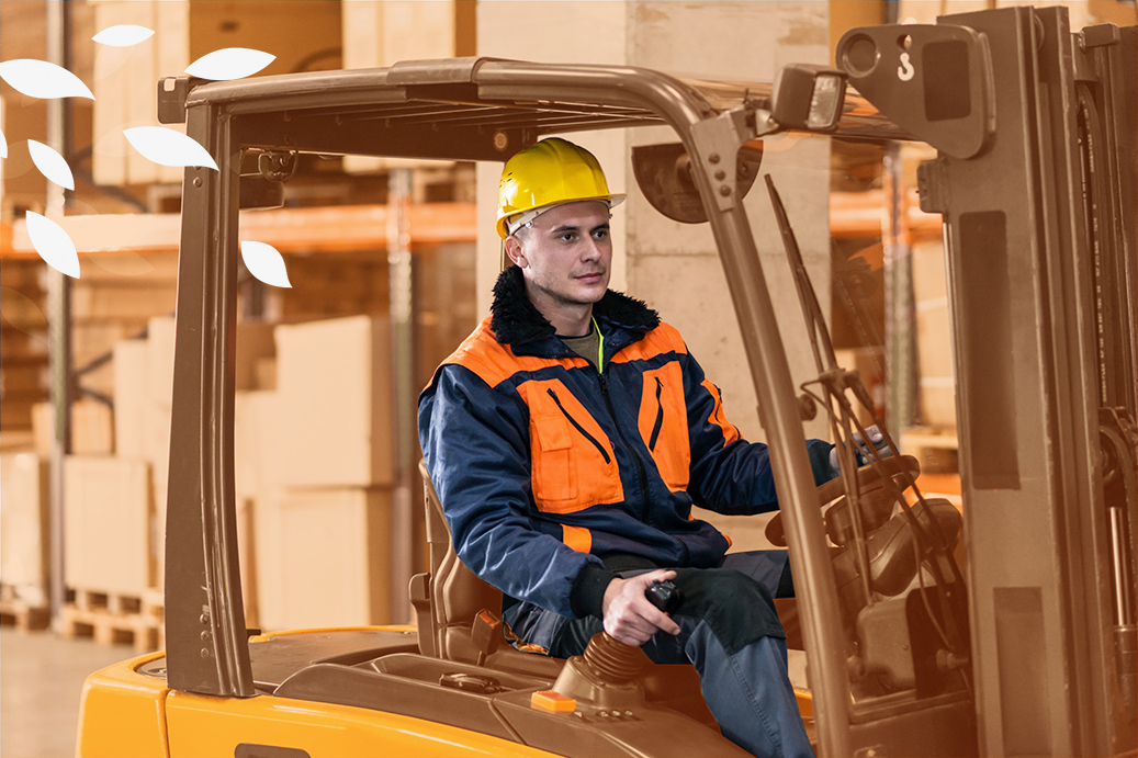 A gentleman is driving a forklift, he's wearing high-vis uniform and a hard hat. There is metal racking in the bacgkround. The image is tinted orange with white leaves coming on to the image on the top left.