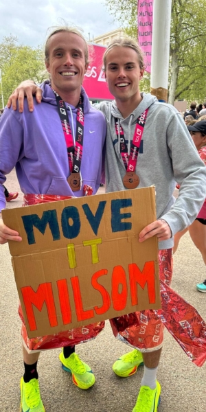 The Milsom brothers standing at the finish line of the London Marathon