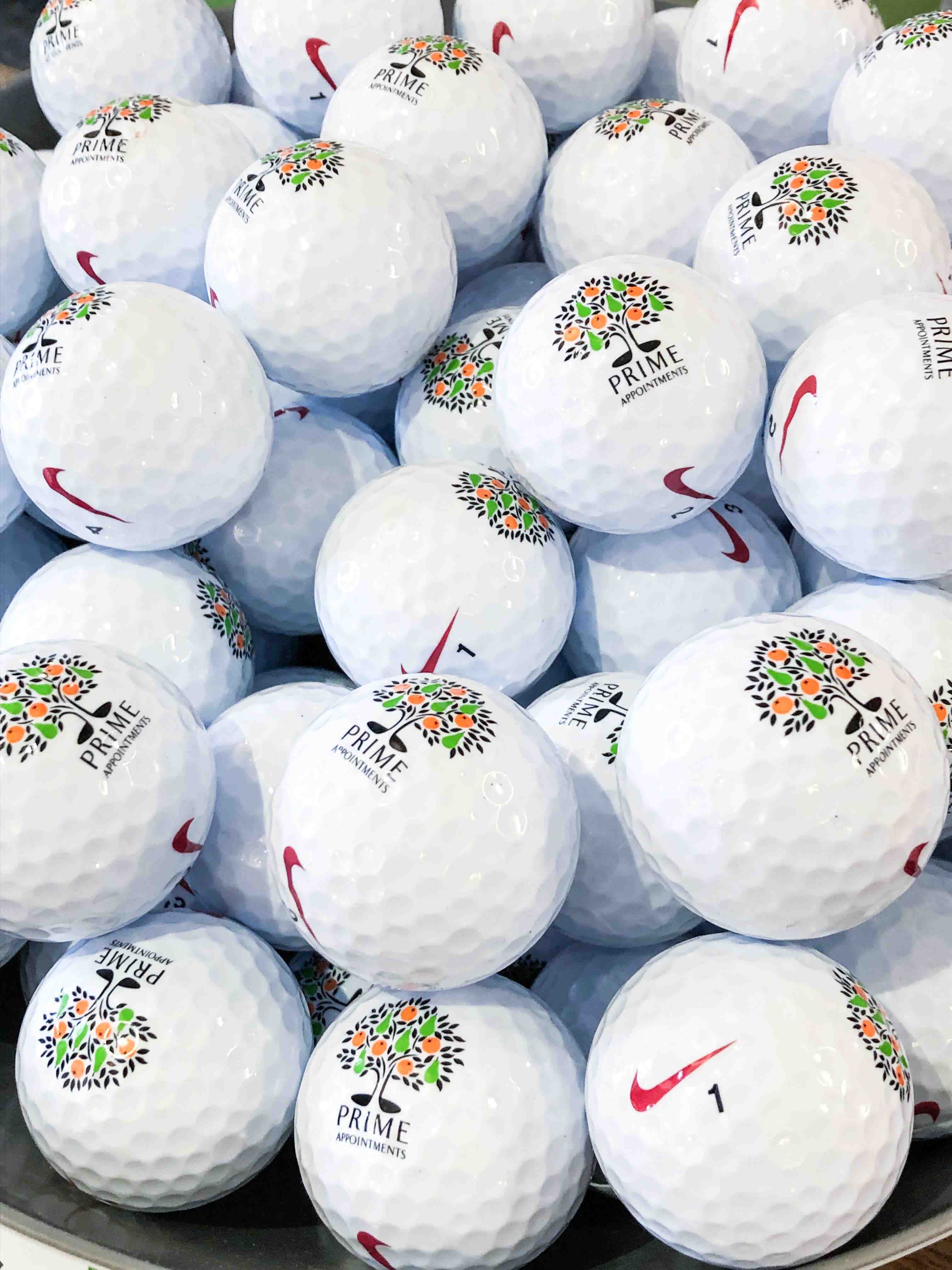 White Golf Balls with Prime Appointments and Nike Logo on