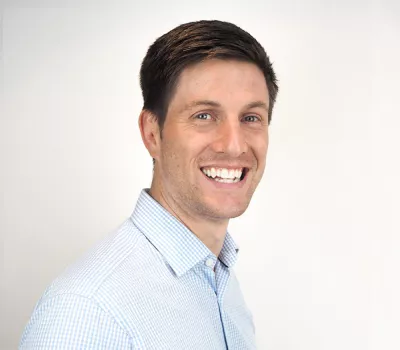 Jack O'Brien (Director) Headshot at Prime Appointments HQ in Witham wearing a blue shirt