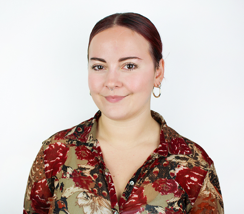 Recruitment consultant Helen, headshot, patterned top white background 2