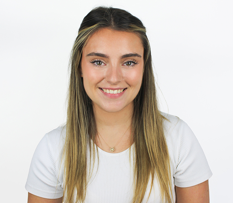 Recruitment consultant Lauren headshot, white top and white background, taken in Witham office