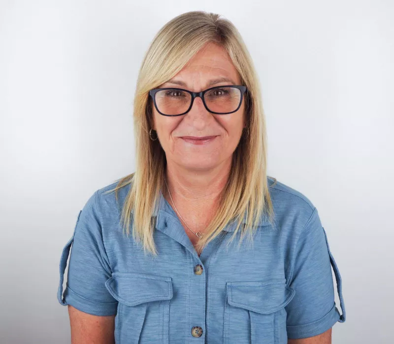 Karen Yaxley (Accounts) Wearing Denim Shirt and Black Glasses, photo taken at Prime Appointments HQ with white background